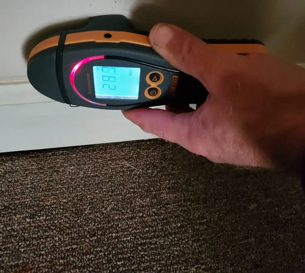 Moisture detection at baseboard during Storm Damage Restoration in Wallkill